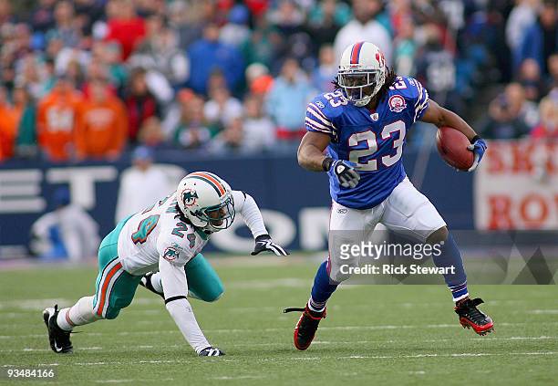 Marshawn Lynch of the Buffalo Bills runs past Sean Smith of the Miami Dolphins at Ralph Wilson Stadium on November 29, 2009 in Orchard Park, New...