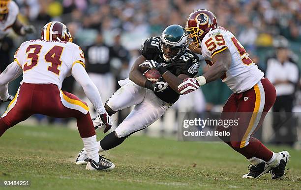 LeSean McCoy of the Philadelphia Eagles is tackled by London Fletcher of the Washington Redskins during their game at Lincoln Financial Field on...