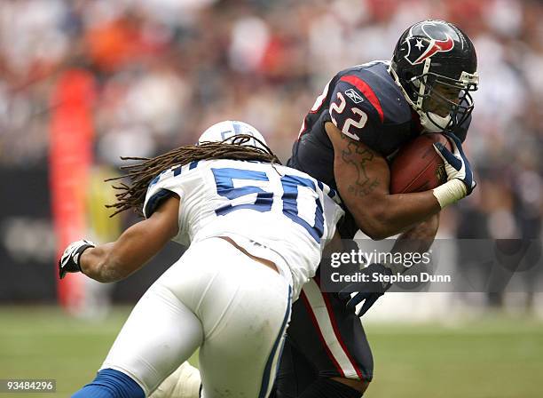 Running back Chris Brown of the Houston Texans carries the ball against linebacker Philip Wheeler of the Indianapolis Colts on November 29, 2009 at...