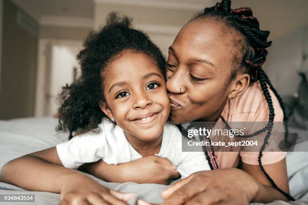 happy parenting - braided hairstyles for african american girls stock pictures, royalty-free photos & images