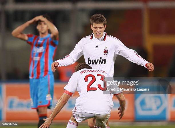 Klaas Huntelar and Massimo Ambrosini of AC Milan celebrate after the Serie A match between Catania Calcio and AC Milan at Stadio Angelo Massimino on...