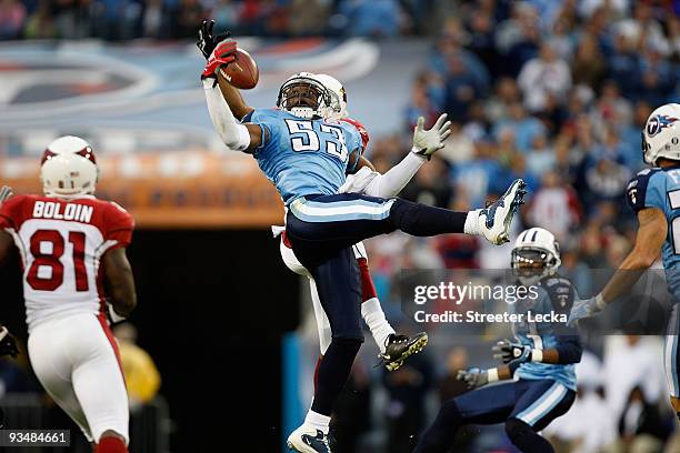 Steve Breaston of the Arizona Cardinals breaks up a pass with Keith Bulluck of the Tennessee Titans during their game at LP Field on November 29,...