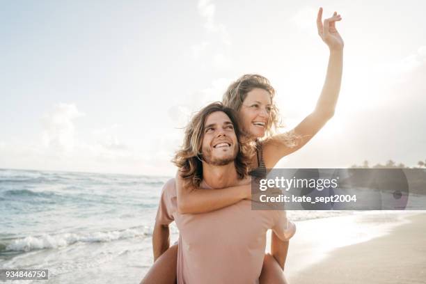 happy couple of 35 years old professionals having vacations on caribbean - 30 39 years imagens e fotografias de stock