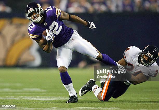 Percy Harvin of the Minnesota Vikings breaks away from Al Afalava of the Chicago Bears on November 29, 2009 at Hubert H. Humphrey Metrodome in...