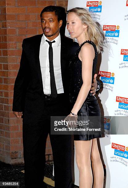 Patrice Evra and guest attend the Manchester United annual gala dinner - United For UNICEF at Old Trafford on November 29, 2009 in Manchester,...