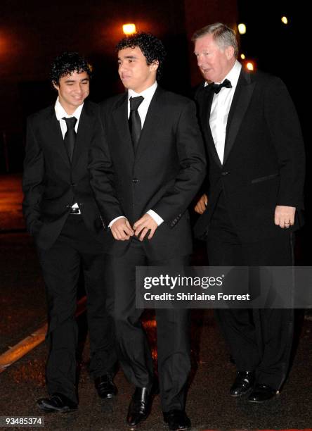 Sir Alex Ferguson, Rafael Da Silva and Fabio Da Silva attend the Manchester United annual gala dinner - United For UNICEF at Old Trafford on November...