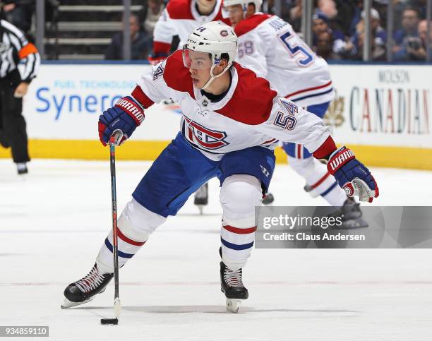 Charles Hudon of the Montreal Canadiens skates with the puck against the Toronto Maple Leafs during an NHL game at the Air Canada Centre on March 17,...