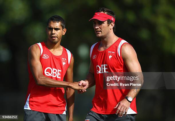 Lewis Jetta , a new recruit of the Swans, meets Daniel Bradshaw of the Swans during a Sydney Swans Training Session at Lakeside Oval on November 30,...