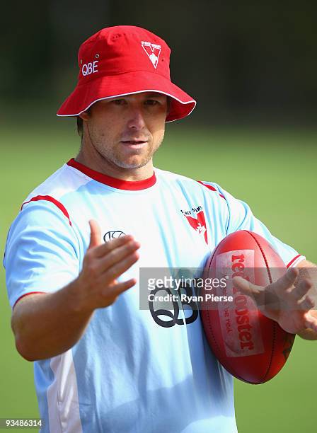 Stuart Dew, the new assistant coach of the Swans, talks to the players during a Sydney Swans Training Session at Lakeside Oval on November 30, 2009...