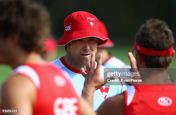 Stuart Dew, the new assistant coach of the Swans, talks to the players during a Sydney Swans Training Session at Lakeside Oval on November 30, 2009...