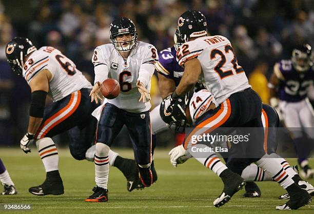 Quarterback Jay Cutler passes the ball off to Matt Forte of the Chicago Bears in the second half against the Minnesota Vikings on November 29, 2009...