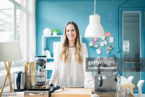 portrait of happy young businesswoman in kitchen of a loft - leisure work coffee happy stockfoto's en -beelden