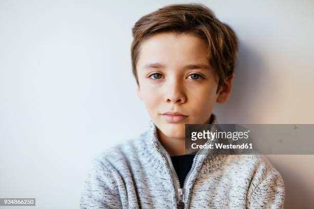 portrait of confident brunette boy - brunette stockfoto's en -beelden