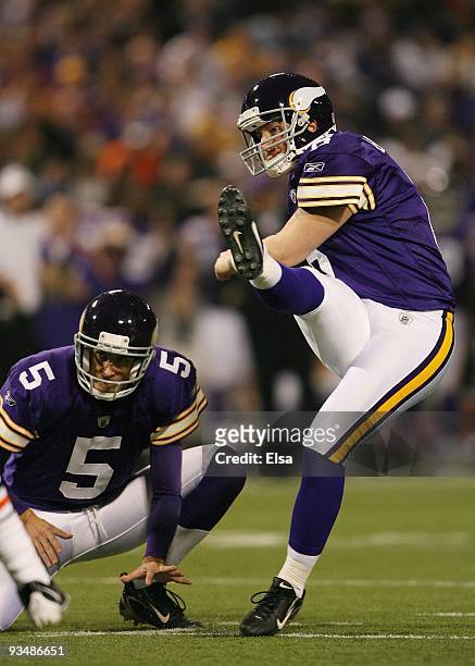 Ryan Longwell of the Minnesota Vikings kicks a field goal as Chris Kluwe holds in the fourth quarter against the Chicago Bears on November 29, 2009...