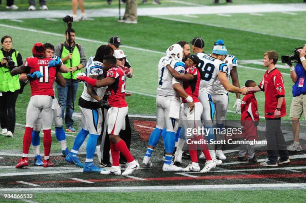 The team captains of the Carolina Panthers meet the Atlanta Falcons prior to the game at Mercedes-Benz Stadium on December 31, 2017 in Atlanta,...