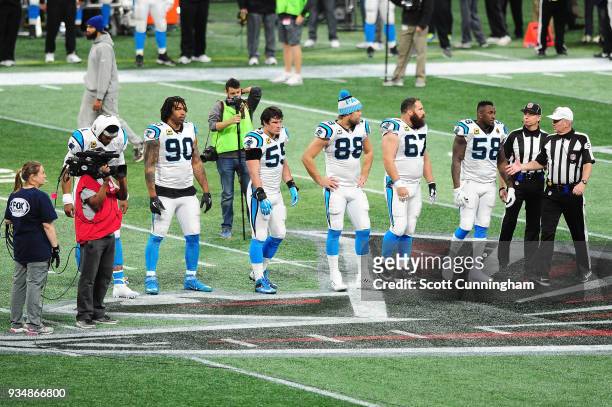 The team captains of the Carolina Panthers meet the Atlanta Falcons prior to the game at Mercedes-Benz Stadium on December 31, 2017 in Atlanta,...