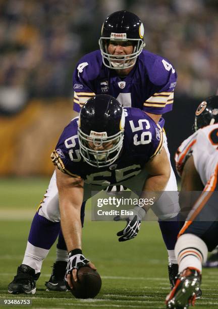 Brett Favre of the Minnesota Vikings takes the hand off from John Sullivan in the second half against the Chicago Bears on November 29, 2009 at...