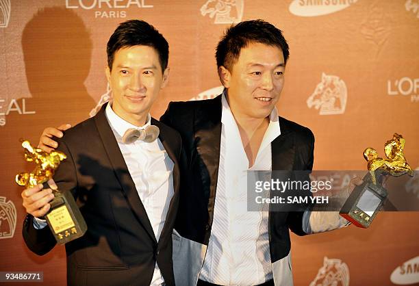 Hong Kong actor Nick Cheung and Chinese actor Huang Bo hold their trophies after sharing the Best Leading Actor Award at the Golden Horse Awards,...