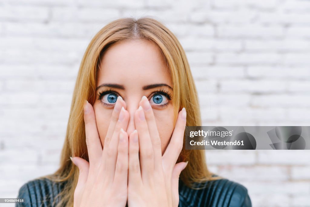 Portrait of surprised young woman