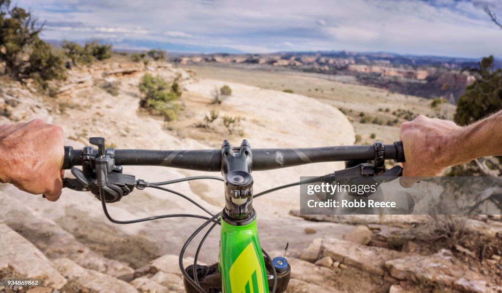First person view of mountain biker on a desert trail