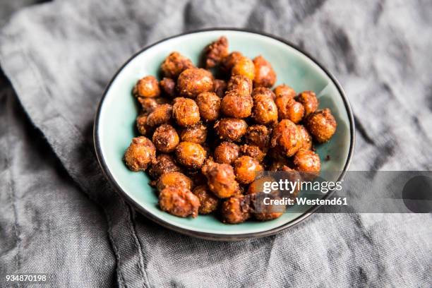 roasted chickpeas in bowl - chickpea stock pictures, royalty-free photos & images