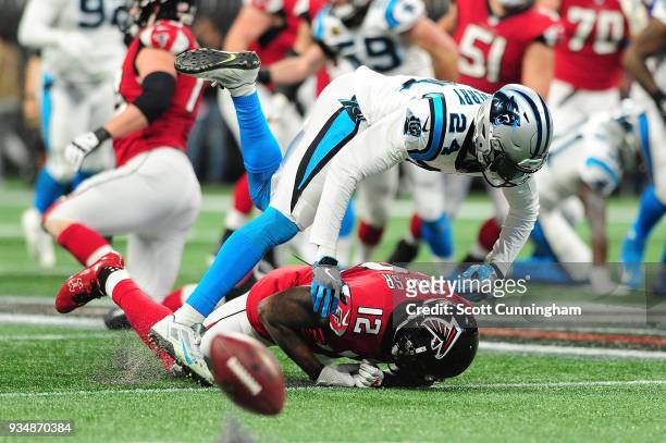 James Bradberry of the Carolina Panthers breaks up a pass intended for Mohamed Sanu of the Atlanta Falcons during the first half at Mercedes-Benz...