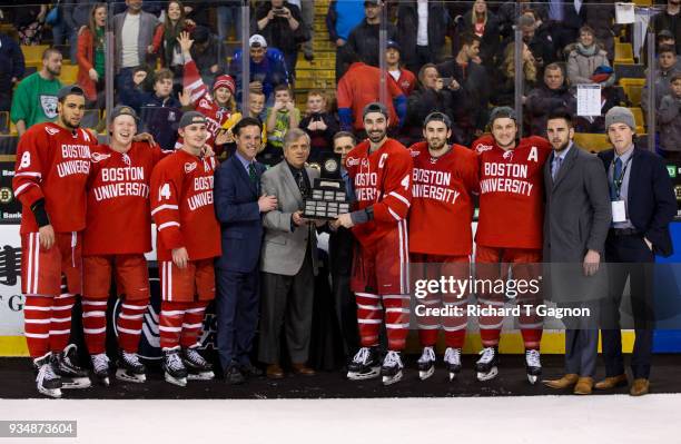 The Boston University Terrier seniors, coach David Quinn of the Boston University Terriers and commissioner Joe Bertagna pose with the Lamoriello...