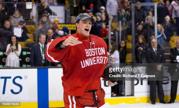 Jake Oettinger of the Boston University Terriers celebrates after winning tournament most valuable player honors against the Providence College...