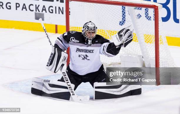 Hayden Hawkey of the Providence College Friars makes a save against the Boston University Terriers during NCAA hockey in the Hockey East Championship...