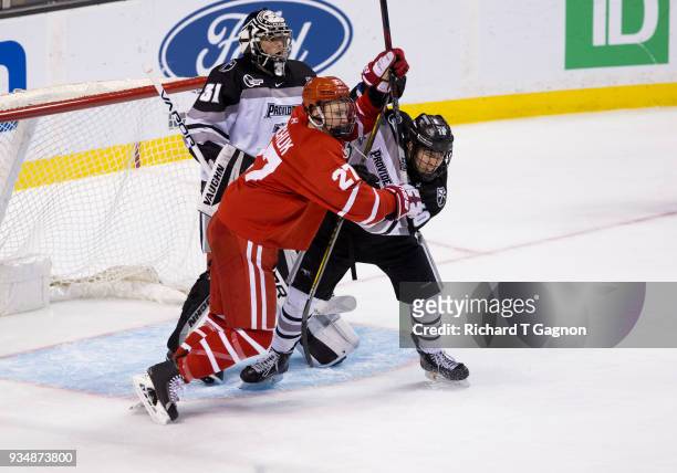 Brady Tkachuk of the Boston University Terriers battles for position against Scott Conway of the Providence College Friars during NCAA hockey in the...