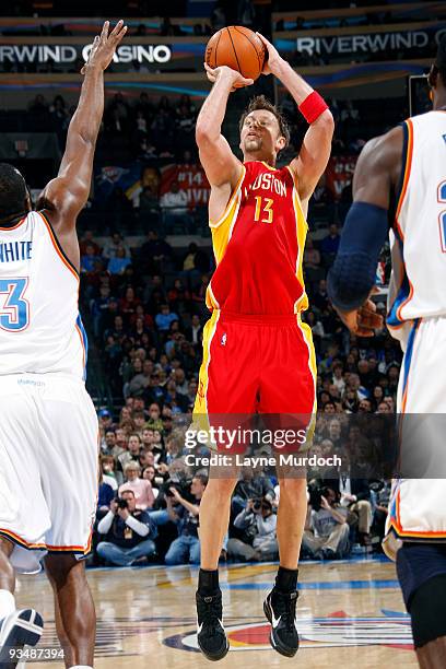 David Anderson of the Houston Rockets shoots a jump shot against D.J. White of the Oklahoma City Thunder on November 29, 2009 at the Ford Center in...