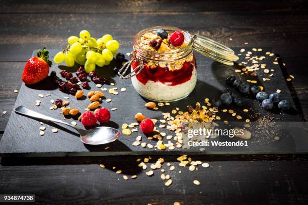 muesli with red fruit jelly, chia, curd, raspberry, almond, cranberry, blue berry, dried banana, grape - almond jelly stock pictures, royalty-free photos & images