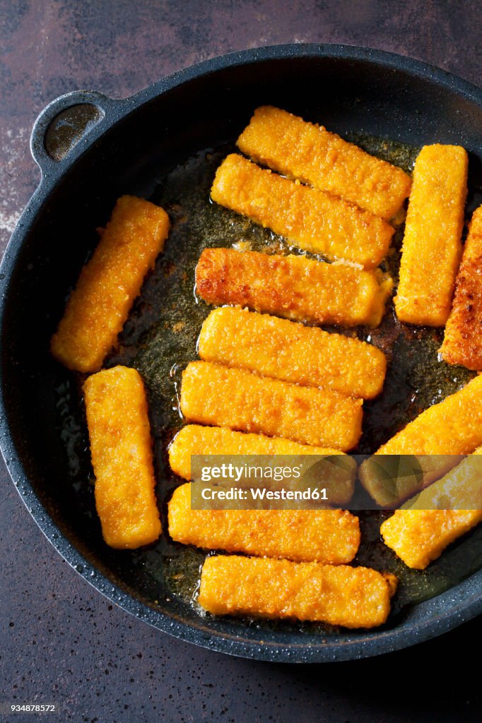 Fish fingers in frying pan