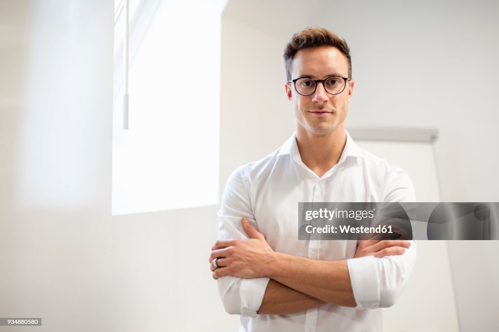 Portrait of confident young businessman in office