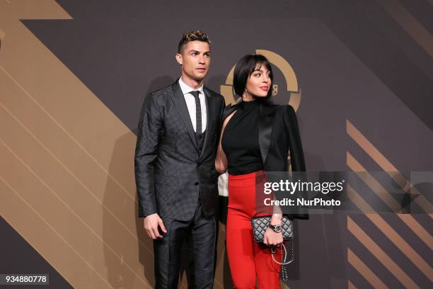 Portugal's forward Cristiano Ronaldo accompanied by Georgina Rodriguez poses on arrival at 'Quinas de Ouro' 2018 ceremony held and the Pavilhao...