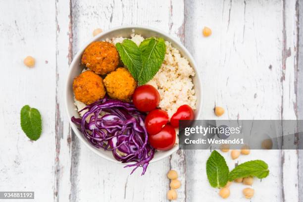 buddha bowl of sweet potato balls, couscous, hummus and vegetables - course meal stock pictures, royalty-free photos & images