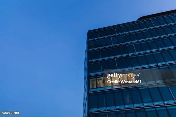 germany, baden-wuerttemberg, office building at night - working overtime imagens e fotografias de stock