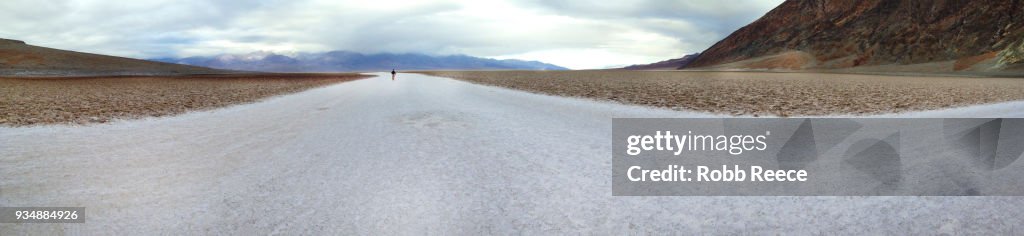 A person walking alone in the remote desert of Death Valley