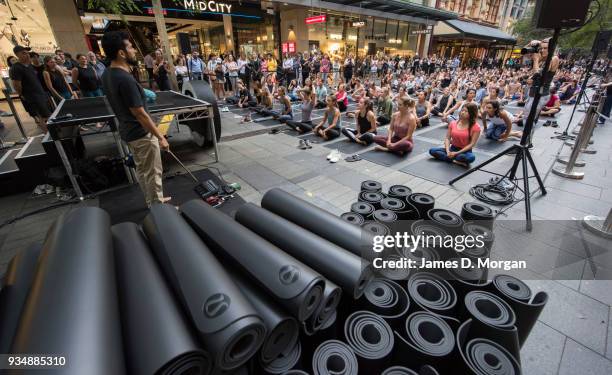 Sydneysiders take part in a mass yoga session on Pitt Street in Sydney's CBD during the evening rush hour on March 20, 2018 in Sydney, Australia. The...