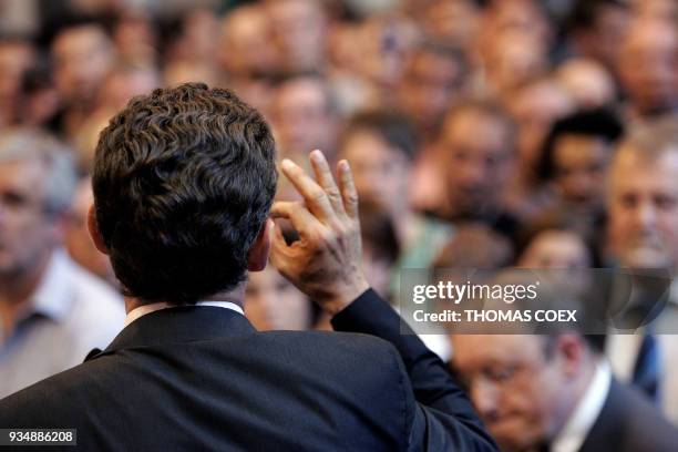 French right-wing presidential candidate of the ruling party Union for a Popular Movement Nicolas Sarkozy delivers a speech gesturing in front of...