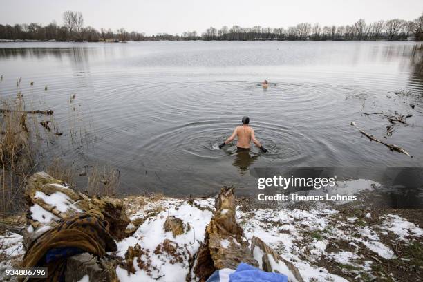 Gustav Meierl and his brother Waldemar Meierl swim in a lake near Biebesheim am Rhein in minus 2 degrees Celcius air temperature on March 19, 2018 in...