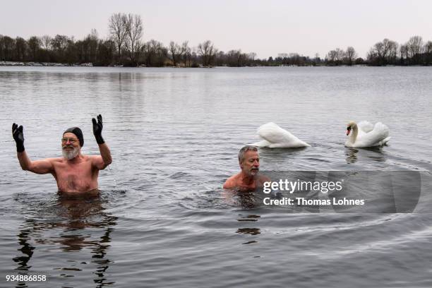 Gustav Meierl and his brother Waldemar Meierl swim in a lake near Biebesheim am Rhein in minus 2 degrees Celcius air temperature on March 19, 2018 in...