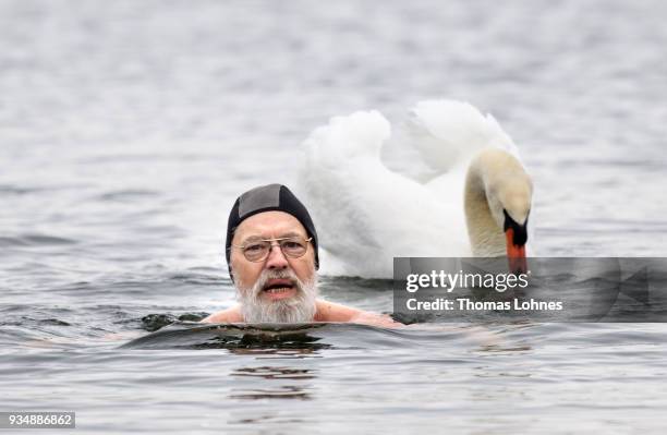 Gustav Meierl and his brother Waldemar Meierl swim in a lake near Biebesheim am Rhein in minus 2 degrees Celcius air temperature on March 19, 2018 in...