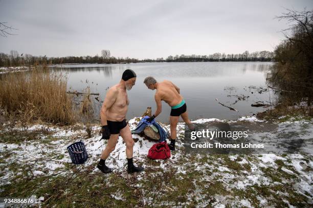 Gustav Meierl and his brother Waldemar Meierl swim in a lake near Biebesheim am Rhein in minus 2 degrees Celcius air temperature on March 19, 2018 in...