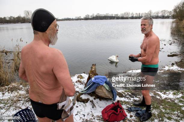 Gustav Meierl and his brother Waldemar Meierl swim in a lake near Biebesheim am Rhein in minus 2 degrees Celcius air temperature on March 19, 2018 in...