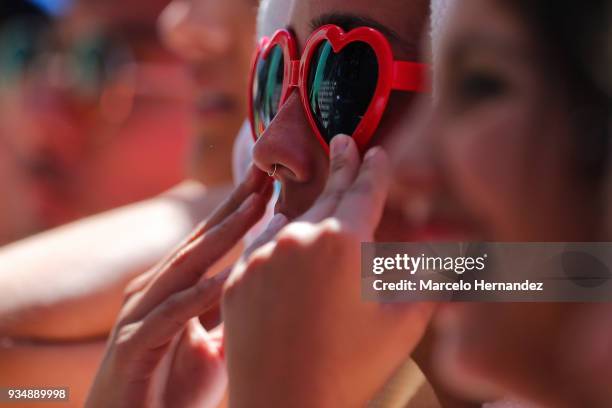 Fans gesture as enjoying the atmosphere during the third day of Lollapalooza Chile 2018 at Parque O'Higgins on March 18, 2018 in Santiago, Chile.