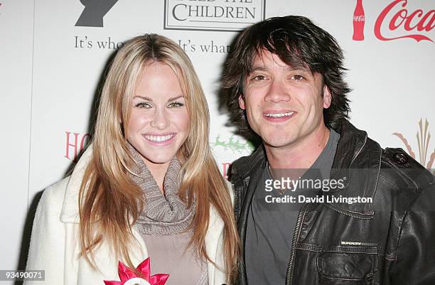 Actors Julie Berman and Dominic Zamprogna arrive for the 2009 Hollywood Christmas Parade at The Roosevelt Hotel on November 29, 2009 in Hollywood,...