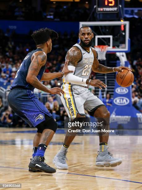 LeBron James of the Cleveland Cavaliers is defended by Elfrid Payton of the Orlando Magic durng the game at the Amway Center on February 6, 2018 in...