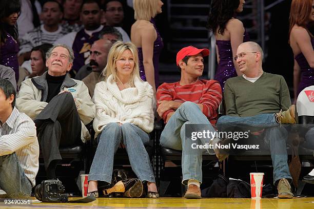 Heather Locklear and Thomas Calabro attend a game between the New Jersey Nets and the Los Angeles Lakers at Staples Center on November 29, 2009 in...