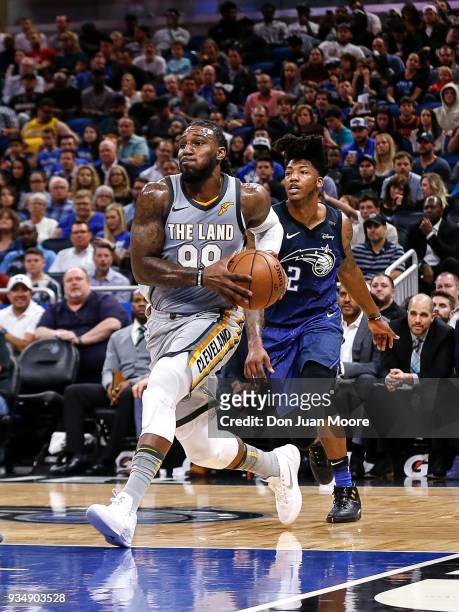 Jae Crowder of the Cleveland Cavaliers drives pass Elfrid Payton of the Orlando Magic during the game at the Amway Center on February 6, 2018 in...